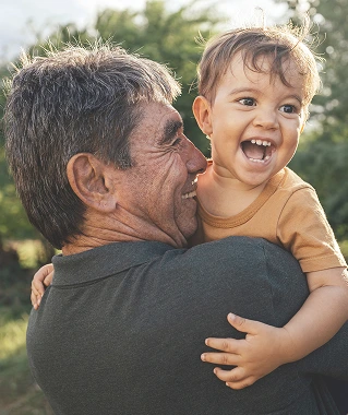 a man holding a laughing child