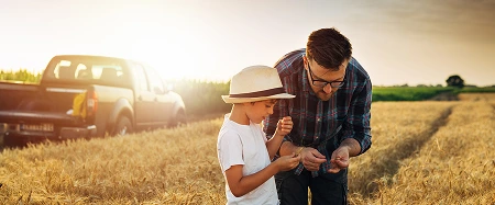 a man and boy in a field
